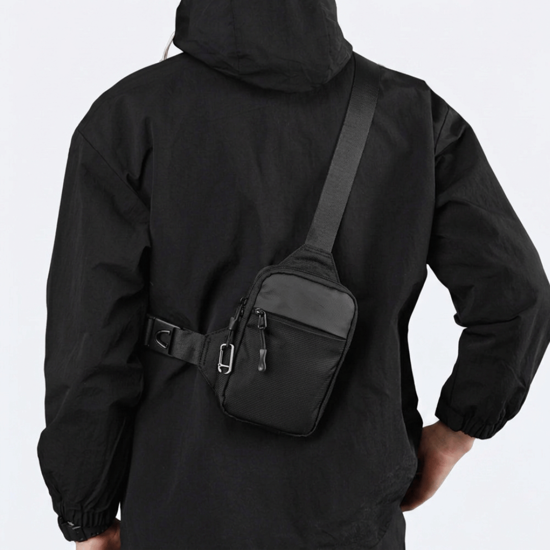 Black sling bag worn while travelling