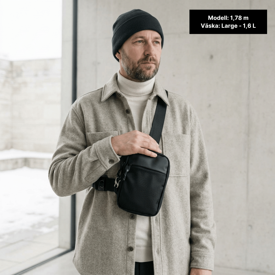 Large sling bag worn by a model