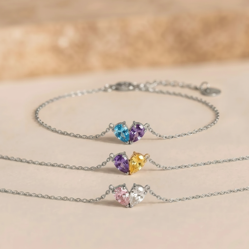 Three silver Lori Bracelets with different birthstone combinations