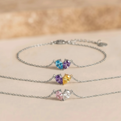 Three silver Lori Bracelets with different birthstone combinations
