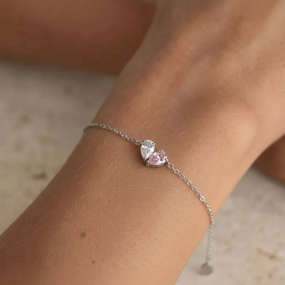 Silver Lori Bracelet worn on wrist, white and pink birthstones