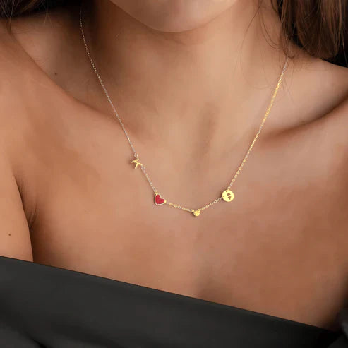 Woman wearing gold personalized heart charm necklace
