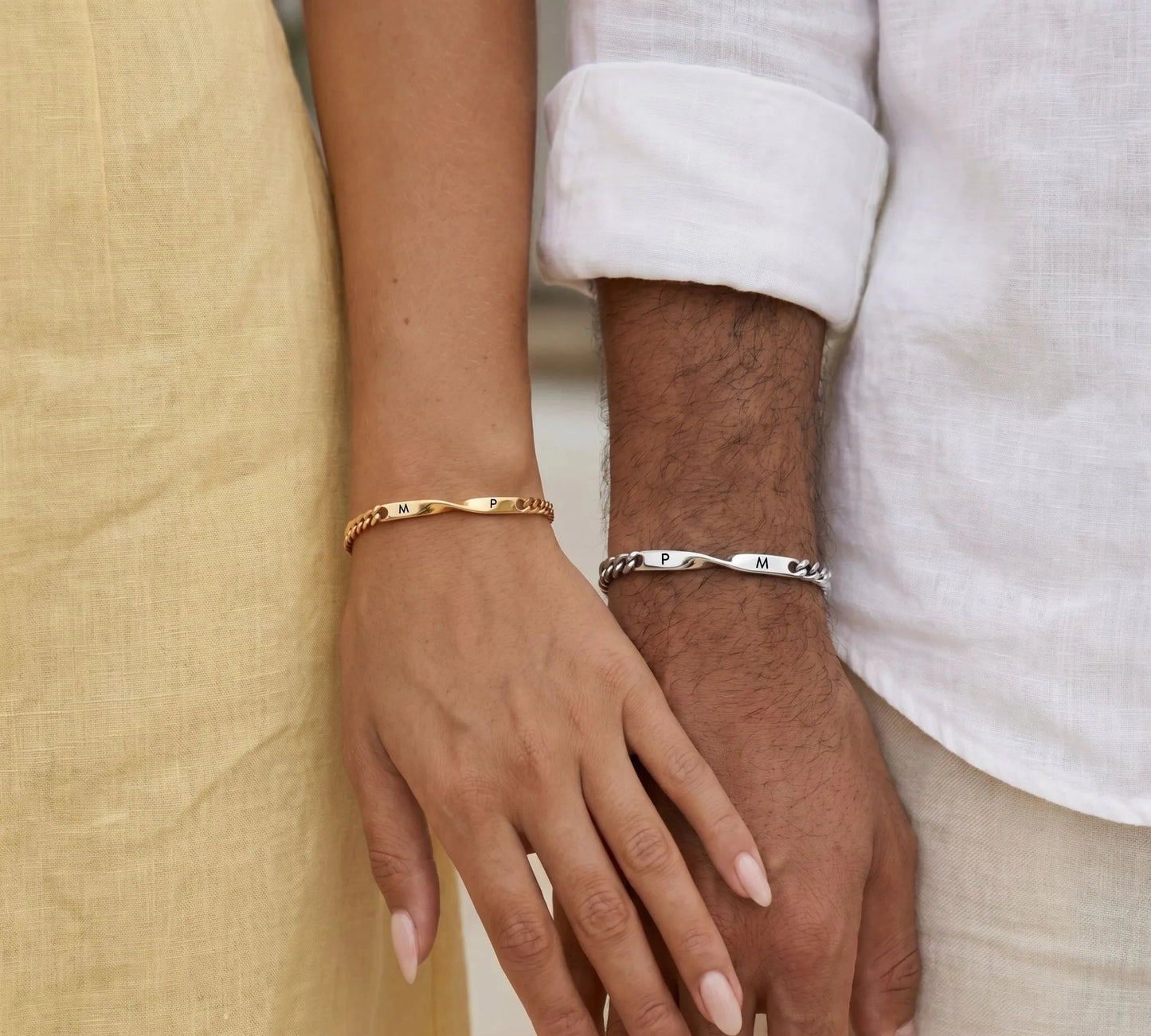 Couple wearing the DUO BRACELET with engraved initials