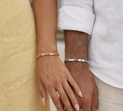 Couple wearing the DUO BRACELET with engraved initials