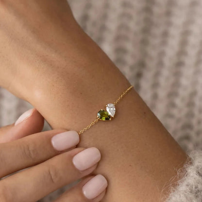 Lori Bracelet in gold with two teardrop birthstones, worn on wrist